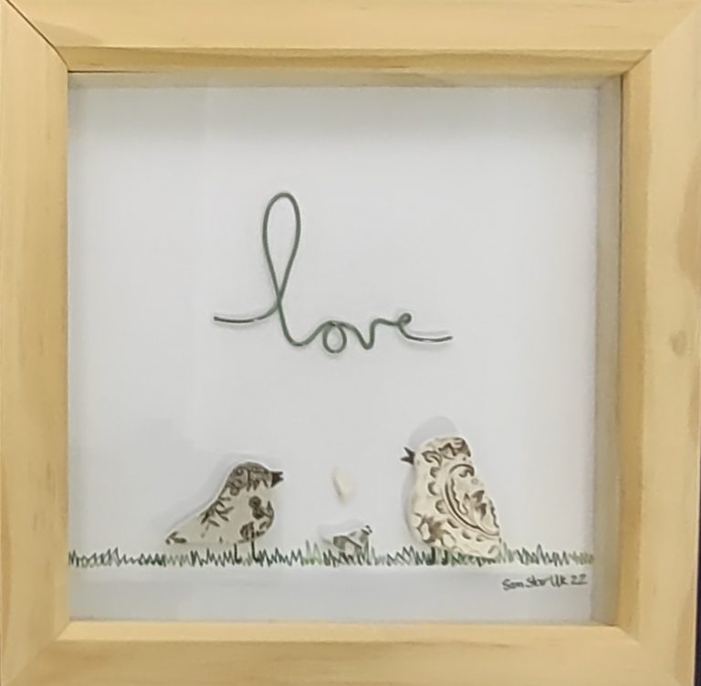 Handmade bird sculptures from sea glass and driftwood