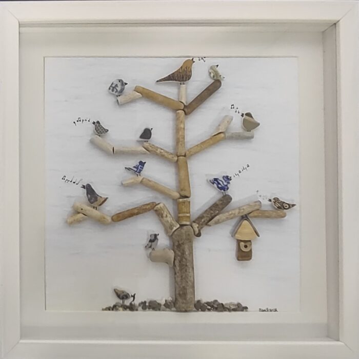 Handmade tree sculptures from driftwood and sea glass